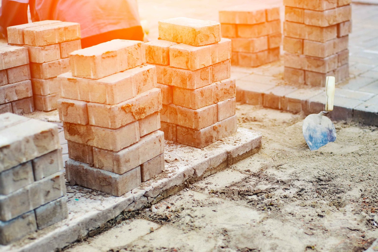 view-new-paving-slabs-concrete-blocks-summer-day-construction-site-stone-blocks-stand-stack (1).jpg_11zon